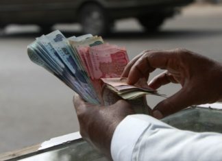 Jobs on Sale Man with bundle of Money in hand